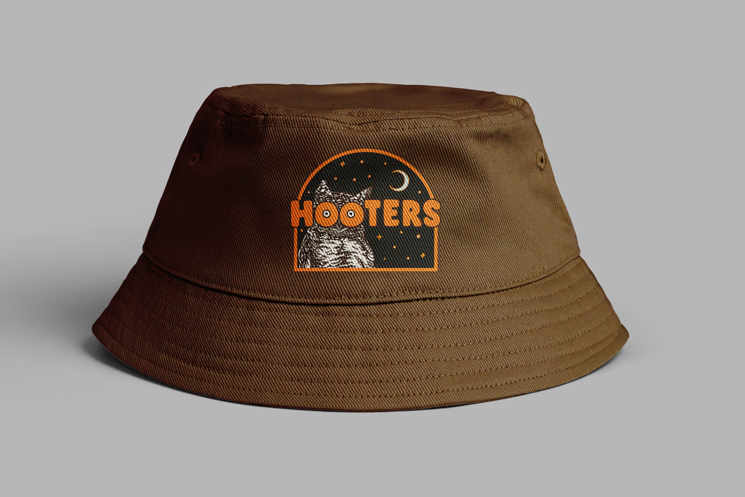 brown bucket hat with a custom Hooters logo